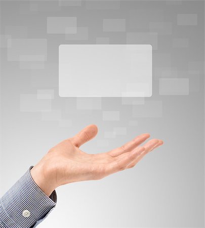 Business hand propose floating touch screens on a light gray background. Stock Photo - Budget Royalty-Free & Subscription, Code: 400-04414070