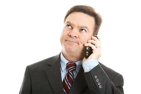 rolling eyes - Businessman rolling his eyes as he listens to a boring phone call or message.  Isolated on white. Stock Photo - Budget Royalty-Free & Subscription, Code: 400-04414080