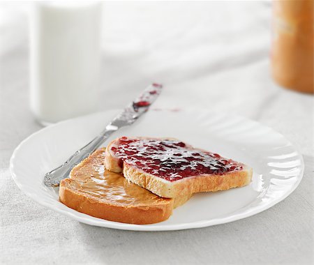 Peanut butter and jelly on pieces of bread. Stock Photo - Budget Royalty-Free & Subscription, Code: 400-04414246