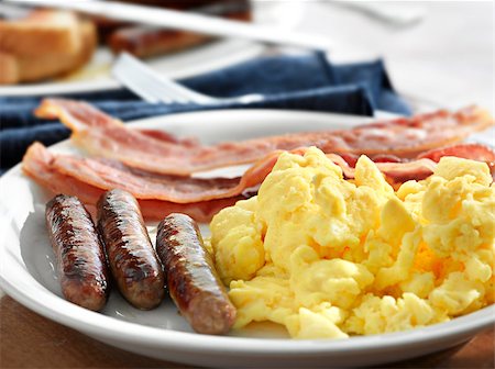 eggs and toast plate - breakfast meal with sausage and scrambled eggs with bacon. Stock Photo - Budget Royalty-Free & Subscription, Code: 400-04414254