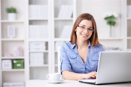 Young beautiful girl with a laptop at home Stock Photo - Budget Royalty-Free & Subscription, Code: 400-04414319