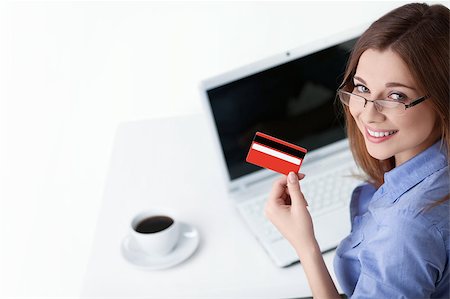 Young girl with laptop and credit card Stock Photo - Budget Royalty-Free & Subscription, Code: 400-04414326