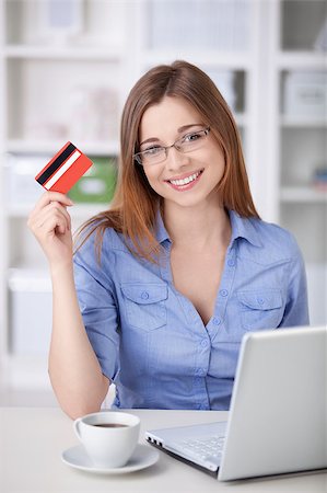 A beautiful girl with a laptop and a credit card at home Stock Photo - Budget Royalty-Free & Subscription, Code: 400-04414327