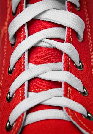 simsearch:400-05283349,k - On red old-fashioned gym shoes a lacing close up Stock Photo - Budget Royalty-Free & Subscription, Code: 400-04414392