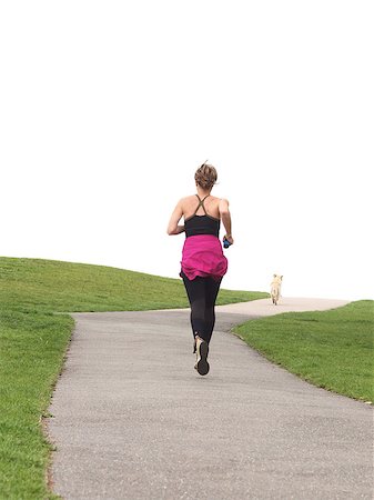 Sexy girl running jogging in the park - over white background Stock Photo - Budget Royalty-Free & Subscription, Code: 400-04414652