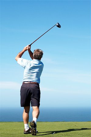 simsearch:400-05038623,k - Senior male golfer playing off the tee box on a summer day Stock Photo - Budget Royalty-Free & Subscription, Code: 400-04414703