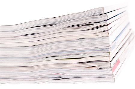 simsearch:400-05901369,k - Closeup of a pile of magazines on white background Stock Photo - Budget Royalty-Free & Subscription, Code: 400-04415262