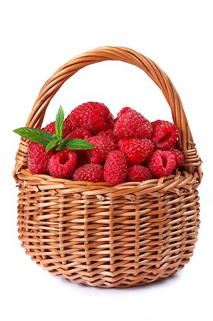 simsearch:400-07993543,k - Fresh sweet raspberries  in a wicker basket on white. Fotografie stock - Microstock e Abbonamento, Codice: 400-04415339