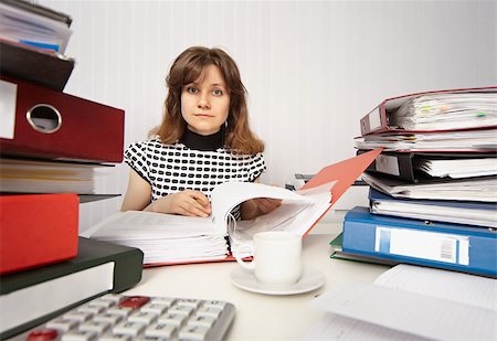 examination folder - Female accountant very busy working in the office Stock Photo - Budget Royalty-Free & Subscription, Code: 400-04416213