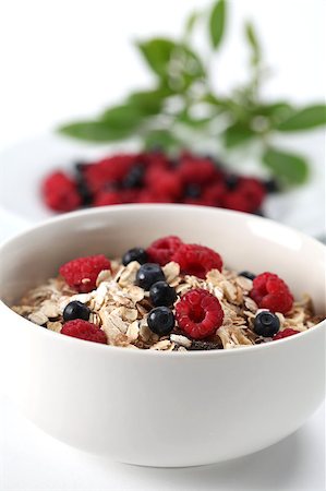 simsearch:400-04416748,k - Granola with fresh organic raspberries and blueberries. Shallow DOF Stock Photo - Budget Royalty-Free & Subscription, Code: 400-04416942