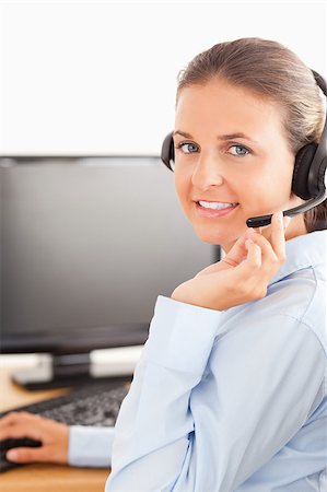 simsearch:400-04472832,k - Close up of an office worker with a headset looking at the camera Stock Photo - Budget Royalty-Free & Subscription, Code: 400-04417299
