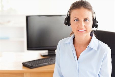simsearch:400-04472832,k - Secretary with a headset posing in her office Stock Photo - Budget Royalty-Free & Subscription, Code: 400-04417300