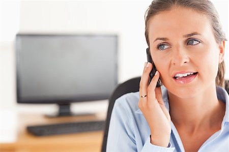 simsearch:400-04008684,k - Cute working woman speaking on the phone in her office Stockbilder - Microstock & Abonnement, Bildnummer: 400-04417319