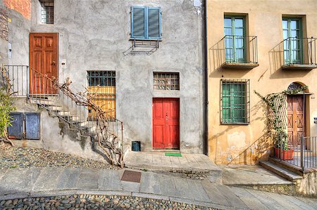 Wooden multicolored doors in the old house at the town of Saluzzo, northern Italy. Stock Photo - Budget Royalty-Free & Subscription, Code: 400-04417605