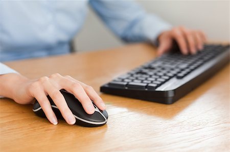 woman with hands on mouse and keyboard in her office Stock Photo - Budget Royalty-Free & Subscription, Code: 400-04417650