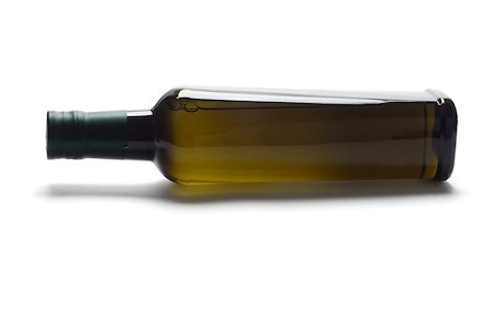 simsearch:400-08154994,k - Bottle of olive oil lying on white background with copy space Stock Photo - Budget Royalty-Free & Subscription, Code: 400-04418009