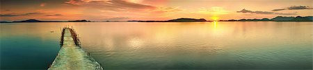 Sunset over the sea. Pier on the foreground. Panorama Foto de stock - Super Valor sin royalties y Suscripción, Código: 400-04418174
