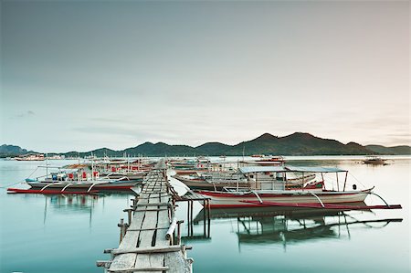 Wooden pier and bahgka boats in Coron Stockbilder - Microstock & Abonnement, Bildnummer: 400-04418177