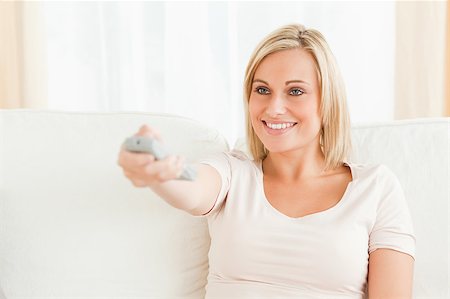 elegant tv room - Close up of a woman watching television in her living room Stock Photo - Budget Royalty-Free & Subscription, Code: 400-04418477