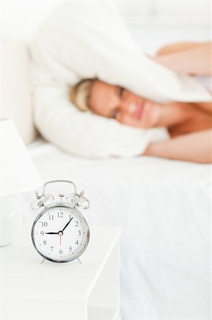 simsearch:400-04903814,k - Portrait of a dissatisfied blonde woman waking up in her bedroom Foto de stock - Royalty-Free Super Valor e Assinatura, Número: 400-04418607