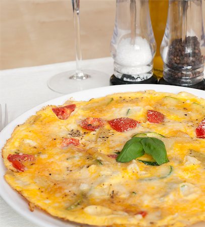 fried egg and pepper - Egg Omelette With Tomatoes and Basil on the Table Stock Photo - Budget Royalty-Free & Subscription, Code: 400-04418837