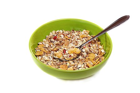 simsearch:400-05735704,k - Muesli with fruit and berries in a green cup on a white background. Photographie de stock - Aubaine LD & Abonnement, Code: 400-04419117