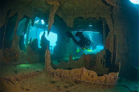 photo underwater ships - Scuba divers exploring a large shipwreck Stock Photo - Budget Royalty-Free & Subscription, Code: 400-04419229