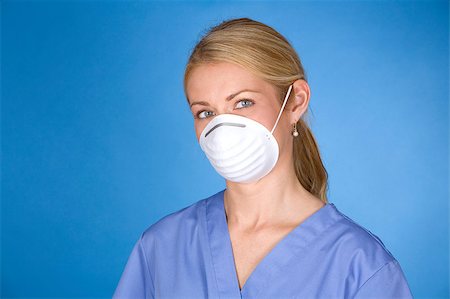 blond healthcare worker wearing blue scrubs and mask Photographie de stock - Aubaine LD & Abonnement, Code: 400-04419519