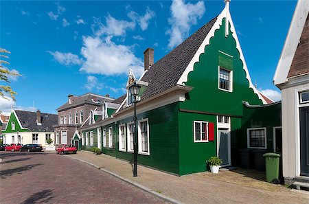 beautiful green wooden houses against in Zaanse Schans, netherlands Photographie de stock - Aubaine LD & Abonnement, Code: 400-04419548