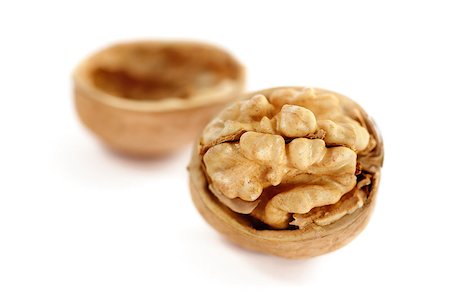 simsearch:400-04415203,k - Chopped walnut on a white background. Fotografie stock - Microstock e Abbonamento, Codice: 400-04410010