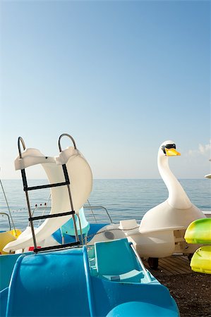 pedal boat - Different boats and boards waiting to be taken out into the bay Stock Photo - Budget Royalty-Free & Subscription, Code: 400-04410022