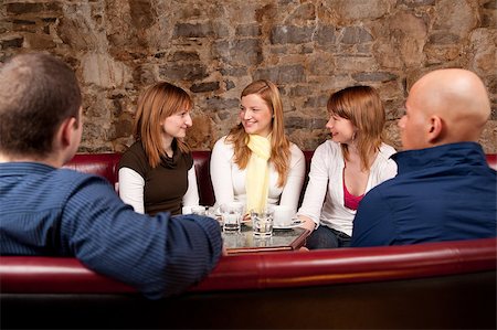 people laughing in pub - Group of five people having fun in cafe Stock Photo - Budget Royalty-Free & Subscription, Code: 400-04410169