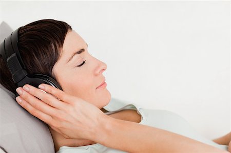 Close up of a short-haired woman enjoying some music with her eyes closed Stock Photo - Budget Royalty-Free & Subscription, Code: 400-04410688