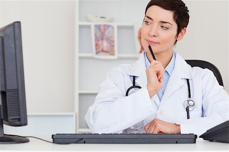 record isolated - Thoughful female doctor in her office Stock Photo - Budget Royalty-Free & Subscription, Code: 400-04410981