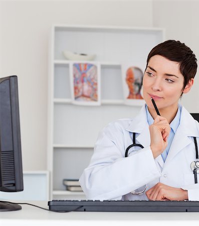 record isolated - Portrait of a thoughful female doctor in her office Stock Photo - Budget Royalty-Free & Subscription, Code: 400-04410982