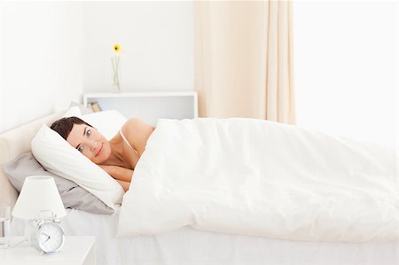 Charming woman waking up in her bedroom Stock Photo - Budget Royalty-Free & Subscription, Code: 400-04411026