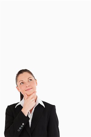 simsearch:400-07464688,k - Pretty woman in suit posing while standing against a white background Photographie de stock - Aubaine LD & Abonnement, Code: 400-04411295
