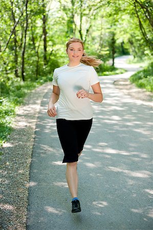 simsearch:400-06768313,k - Attractive young woman on a run in nature Photographie de stock - Aubaine LD & Abonnement, Code: 400-04411456