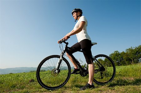 simsearch:400-04890875,k - Young girl riding a bike on a field path - offroad Stock Photo - Budget Royalty-Free & Subscription, Code: 400-04411529