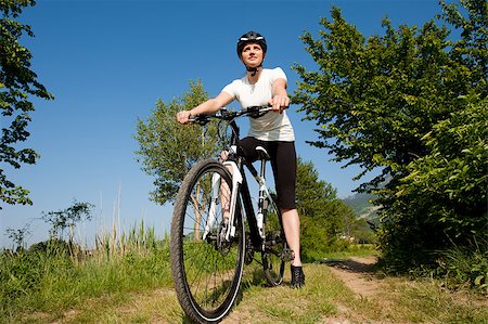 simsearch:400-04890875,k - Young girl riding a bike on a field path - offroad Stock Photo - Budget Royalty-Free & Subscription, Code: 400-04411552
