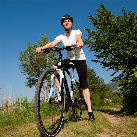 simsearch:400-04890875,k - Young girl riding a bike on a field path - offroad Stock Photo - Budget Royalty-Free & Subscription, Code: 400-04411569