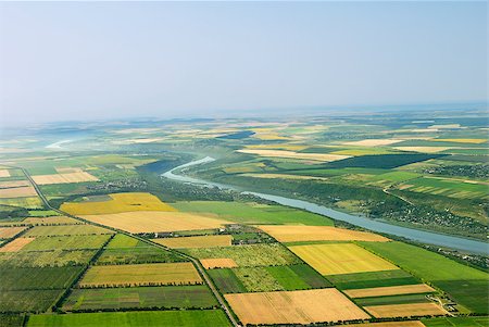 river eye - Air view, birds eye view of the fields and hills Fotografie stock - Microstock e Abbonamento, Codice: 400-04411874