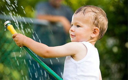 boy having fun with water in the summer Stock Photo - Budget Royalty-Free & Subscription, Code: 400-04413187