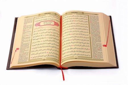 The Holy Koran opened and isolated on white background Fotografie stock - Microstock e Abbonamento, Codice: 400-04424015