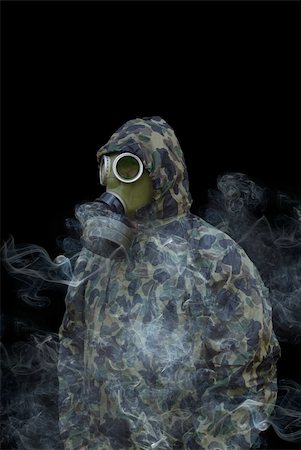 the man in anti-gas mask in vapours of gas Stock Photo - Budget Royalty-Free & Subscription, Code: 400-04424483