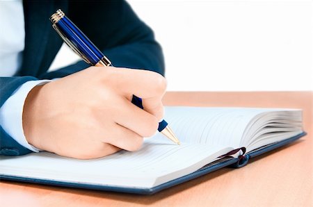 Cropped image of hand of young woman taking notes Stock Photo - Budget Royalty-Free & Subscription, Code: 400-04424608