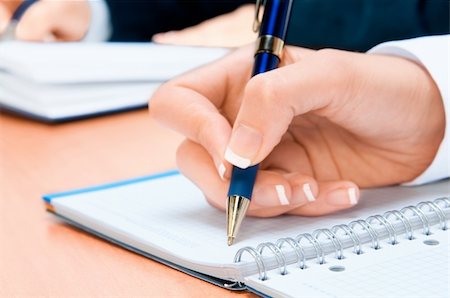 Cropped image of hand of young woman taking notes Stock Photo - Budget Royalty-Free & Subscription, Code: 400-04424610
