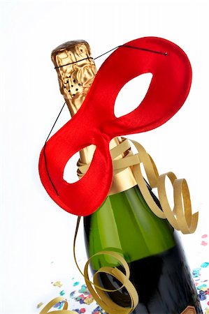 simsearch:400-05082002,k - Detail of champagne bottle with red mask, ribbons and confetti Photographie de stock - Aubaine LD & Abonnement, Code: 400-04425290