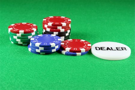 Poker chips with a dealers chip on green baize Stock Photo - Budget Royalty-Free & Subscription, Code: 400-04425301