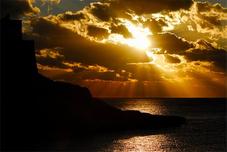 picture of a sunset over the southern mediterranean from the picturesque bay of xlendi gozo Foto de stock - Super Valor sin royalties y Suscripción, Código: 400-04425570